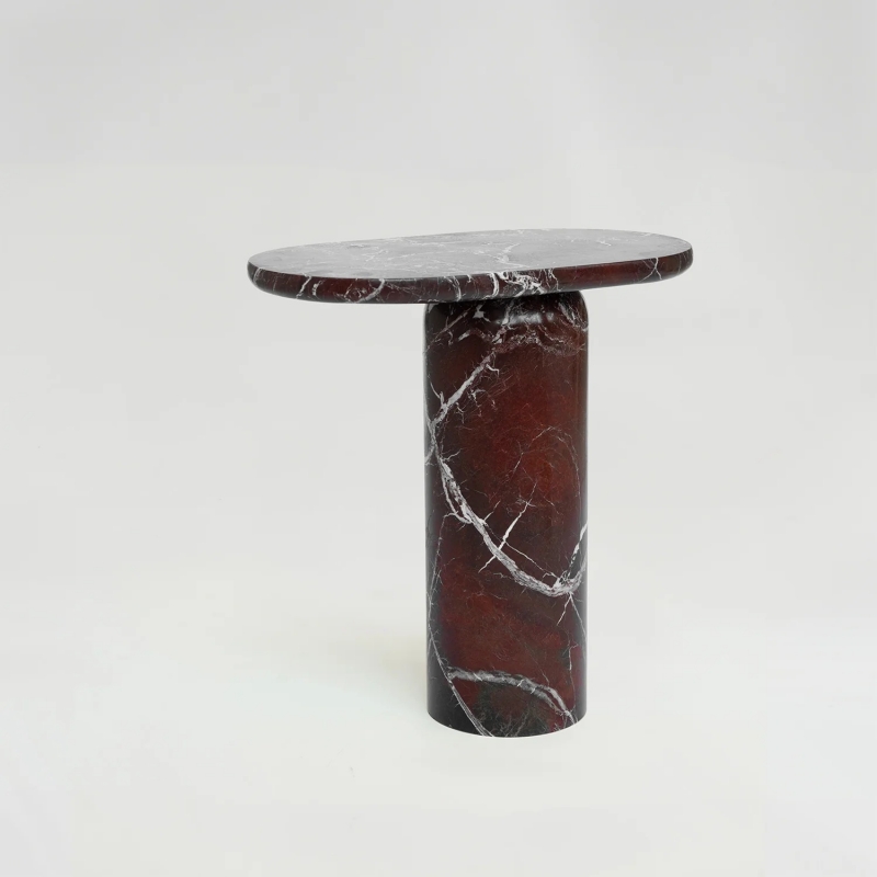 Burgundy veined marble side table with cylindrical base on wooden floor - modern living room accent furniture