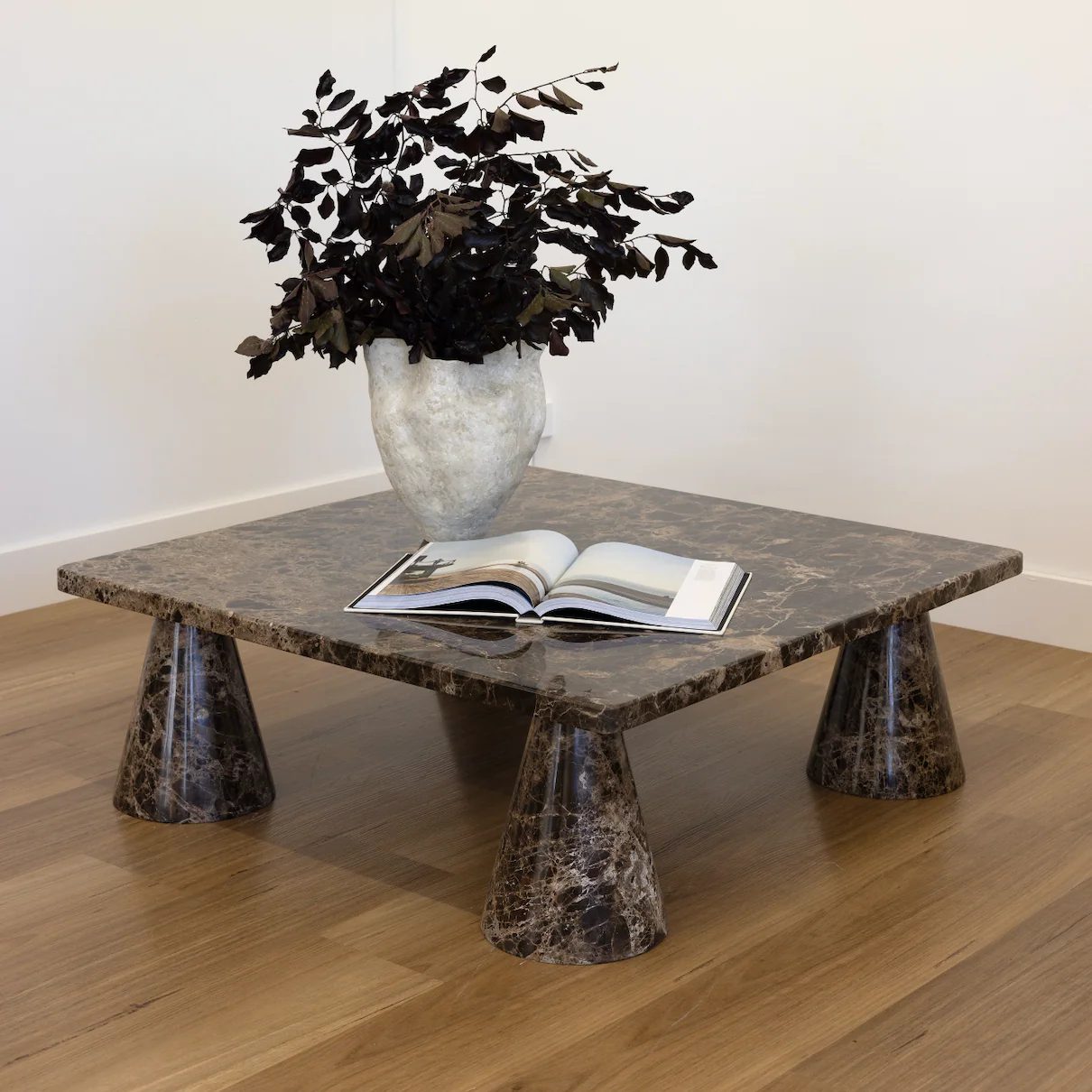 Dark brown veined marble coffee table with flared bases