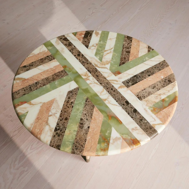 Top-down view of geometric multi-marble round table - mosaic stone pattern centerpiece