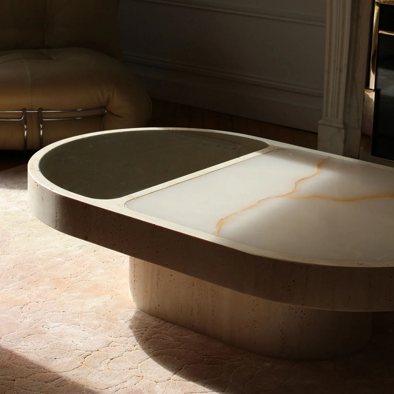 Travertine & Onyx Coffee Table next to beige leather sofa