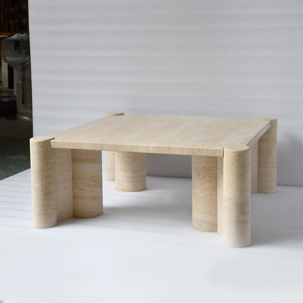 Close-up of travertine coffee table corner - cylindrical leg and natural stone texture detail