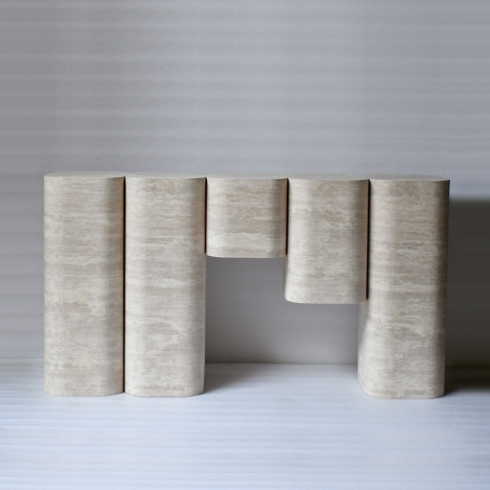 Modern minimalist beige travertine console table with sculptural curved pillars for entryway.