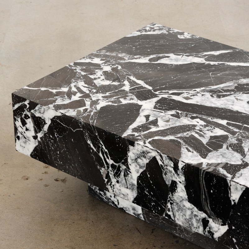 Black marble console table with cylindrical pedestal base - bold modern statement furniture