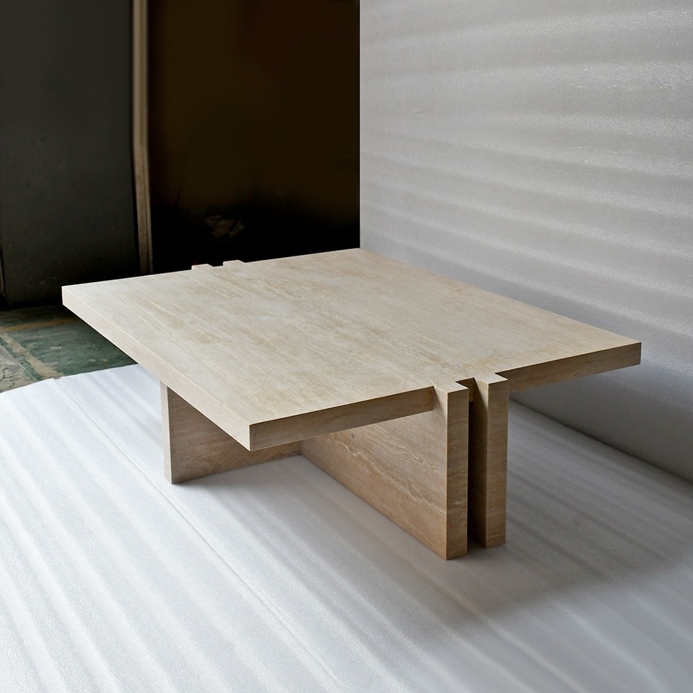 Close-up of travertine coffee table - interlocking leg joint and natural stone texture