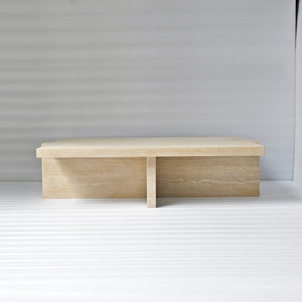 Low-profile travertine coffee table with puzzle-joint legs - modern living room centerpiece