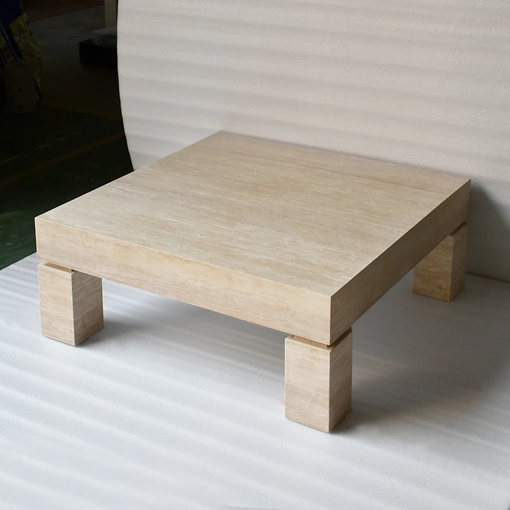 Modern minimalist beige travertine coffee table with four square block legs