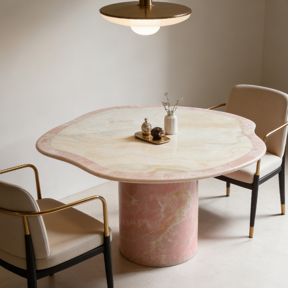 Organic free‑form pink onyx dining table styled in soft modern dining room